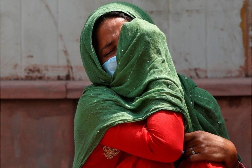India coronavirus: 'Stay positive' call amid raging pandemic