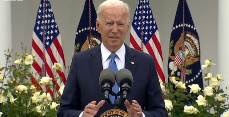 Biden hails 'great day' as he sheds mask in Oval Office