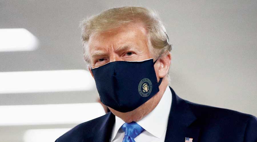Finally, Trump wears mask in public